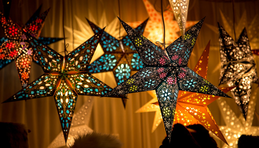 Paper star shaped lamps lit up