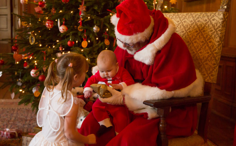 Two children with Santa Claus