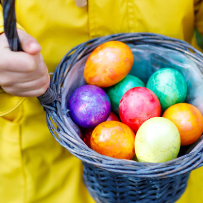 A collection of painted eggs in a basket.