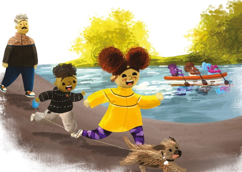 A girl, a boy and a dog run down the banks of a river.