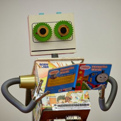 Crafted robot reading a Thomas the Tank engine book