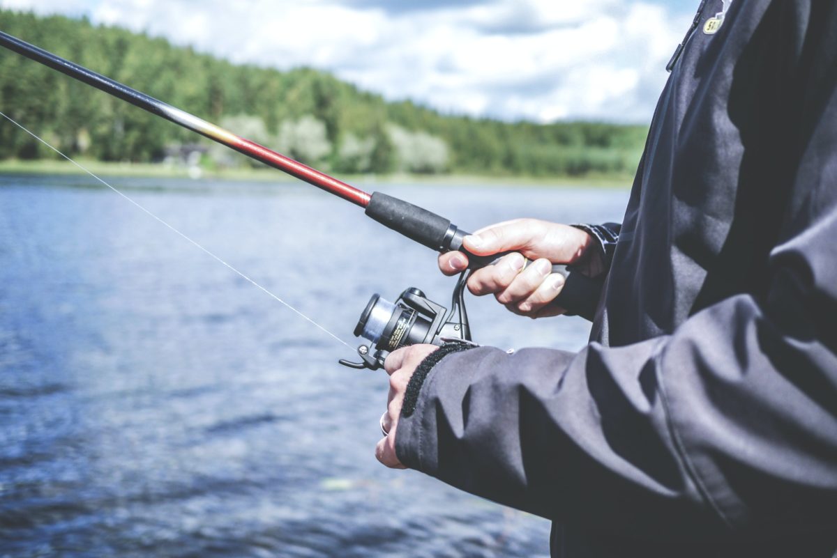 A person fishing in a lake.