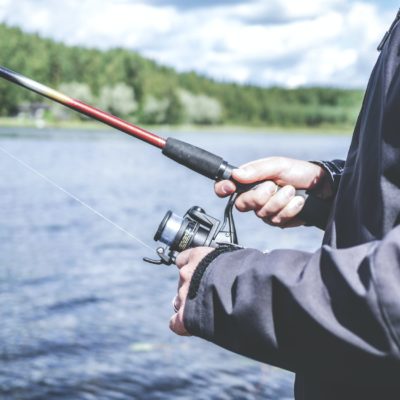 A person fishing in a lake.