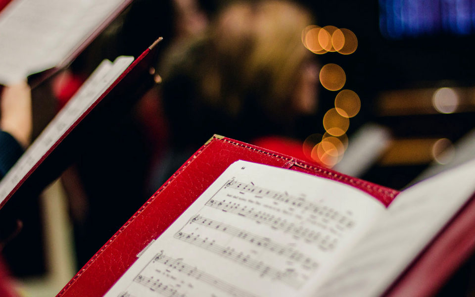 A red folder with sheet music.