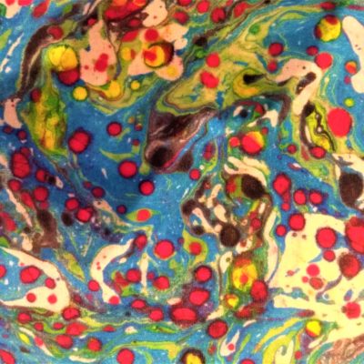 The colourful marble effect created from the swirling of different coloured paint.