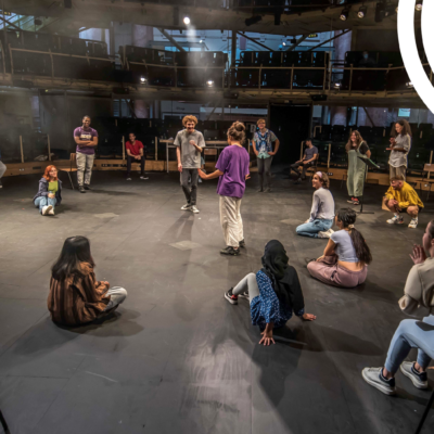 Young people enjoy a workshop on the Royal Exchange stage.