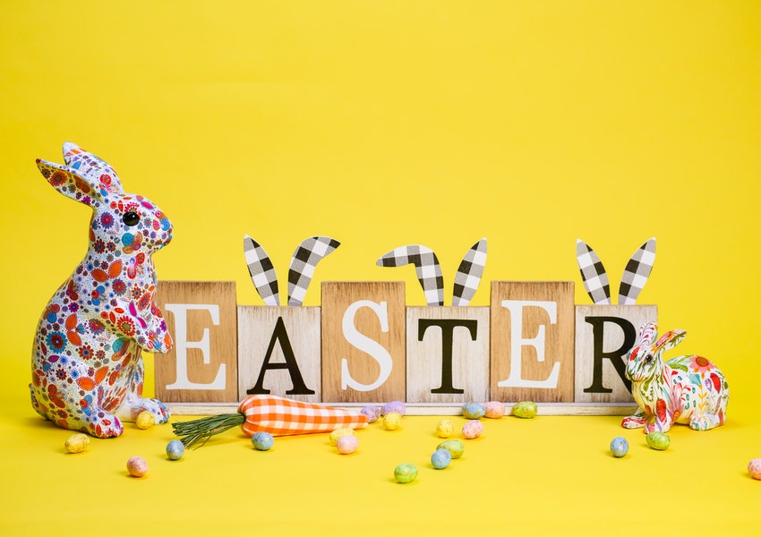 A set of wooden alphabet blocks that spell out the word Easter and a patchwork bunny.