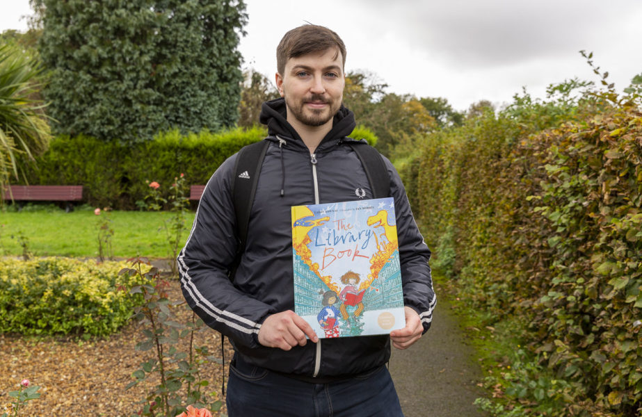 Illustrator Ian Morris holds his book 'The Library Book'.