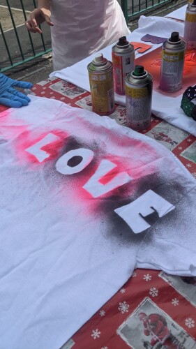 A T-shirt with "Love" spray painted on it