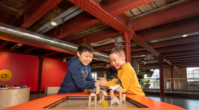 Two boys playing with blocks in the Experiment Gallery at the Science and Industry Museum